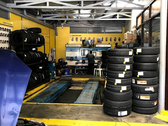 Stacked tires and the service area at Roadstar Alabang