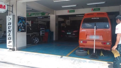 A van in the service bay at C.A.L. Startire Autocare in Mandaue City